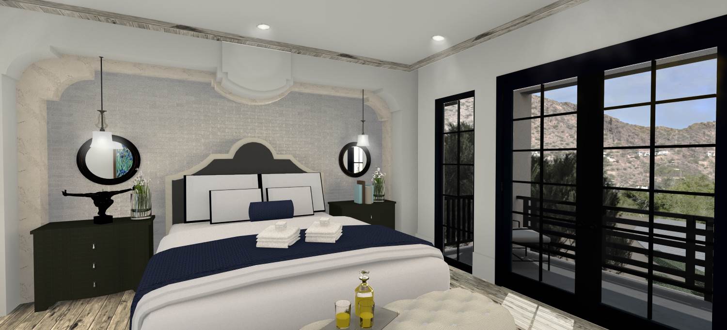 Grand guest bedroom with seating area and a private patio.